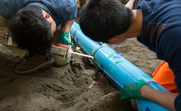 A glue gun was used to attach the sensors to the plastic pipe. Photo by Patrick Shanahan, Cornell University.