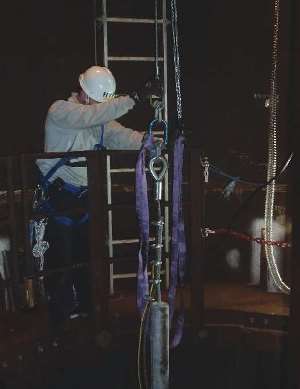 A trial anode string is lowered into the monopile’s contained water. Photo courtesy of Alex Delwiche.