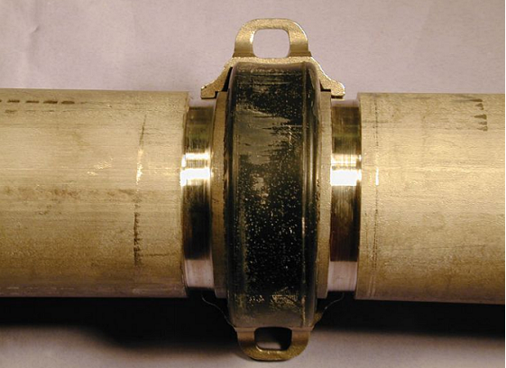FIGURE 5 A typical high-pressure coupling with one half clamp removed.