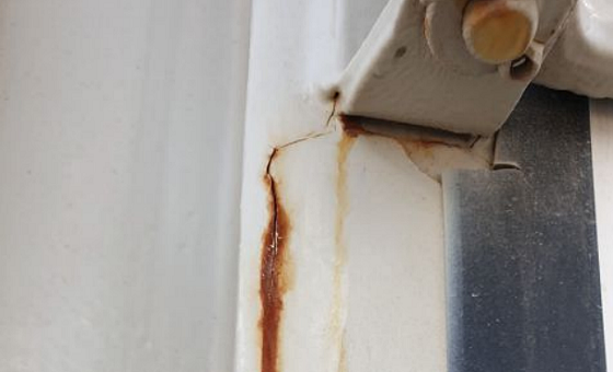 Heavy rust stains coming out from paint cracks near welded support connection. Photo courtesy of the author.