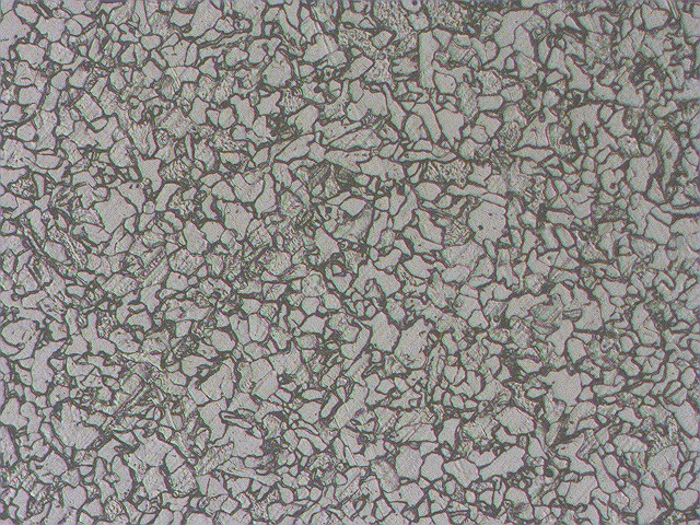 FIGURE 4, At 100x, uniform distribution of ferrite and pearlite shown.