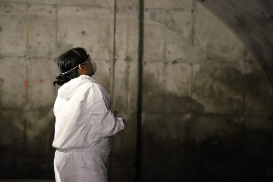 A ERDC-CERL team member assesses mold in the ECMs.