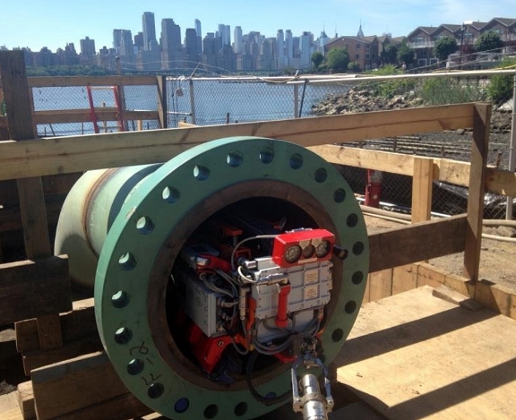 FIGURE 2: A robotic crawler is positioned at the access point created on the Transco Pipeline. Photo courtesy of Diakont.