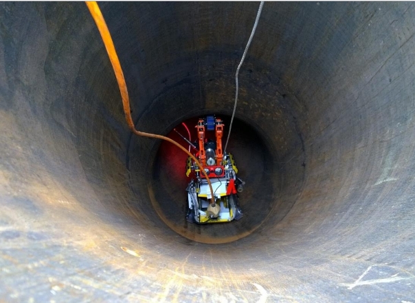 FIGURE 5: The robotic ILI crawler is launched vertically on one of the TAPS inspection routes. Photo courtesy of Diakont.
